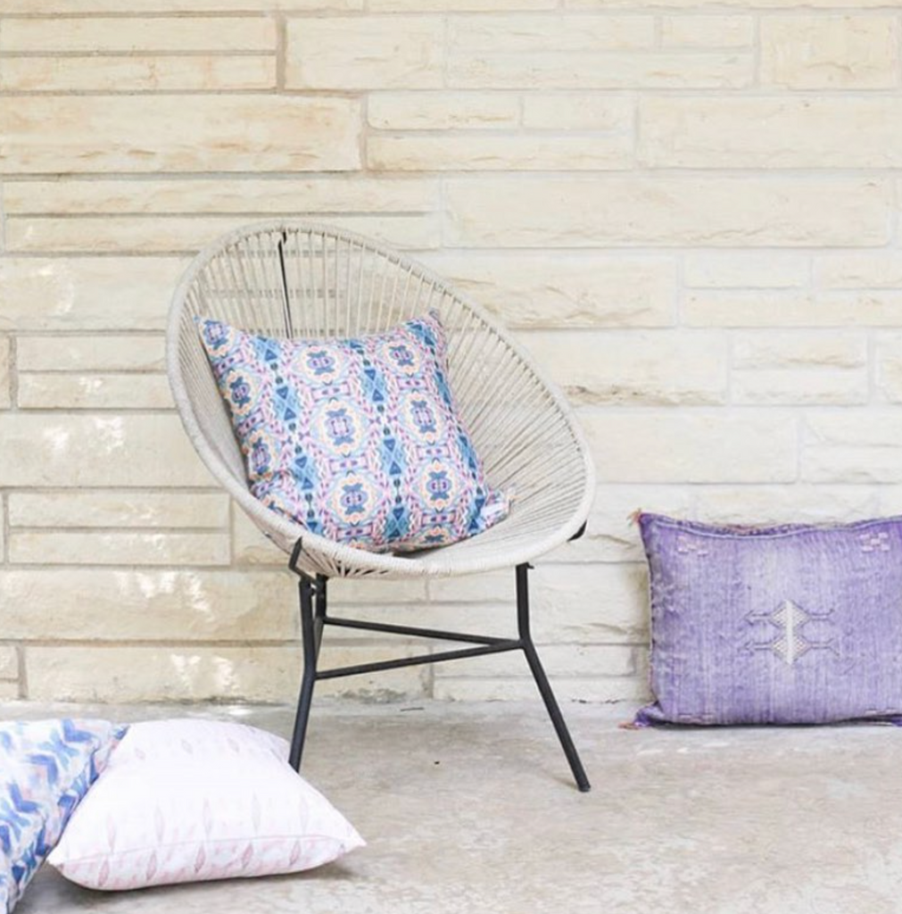 Blue and purple floral patterned pillow by bunglo, sold at anthropologie